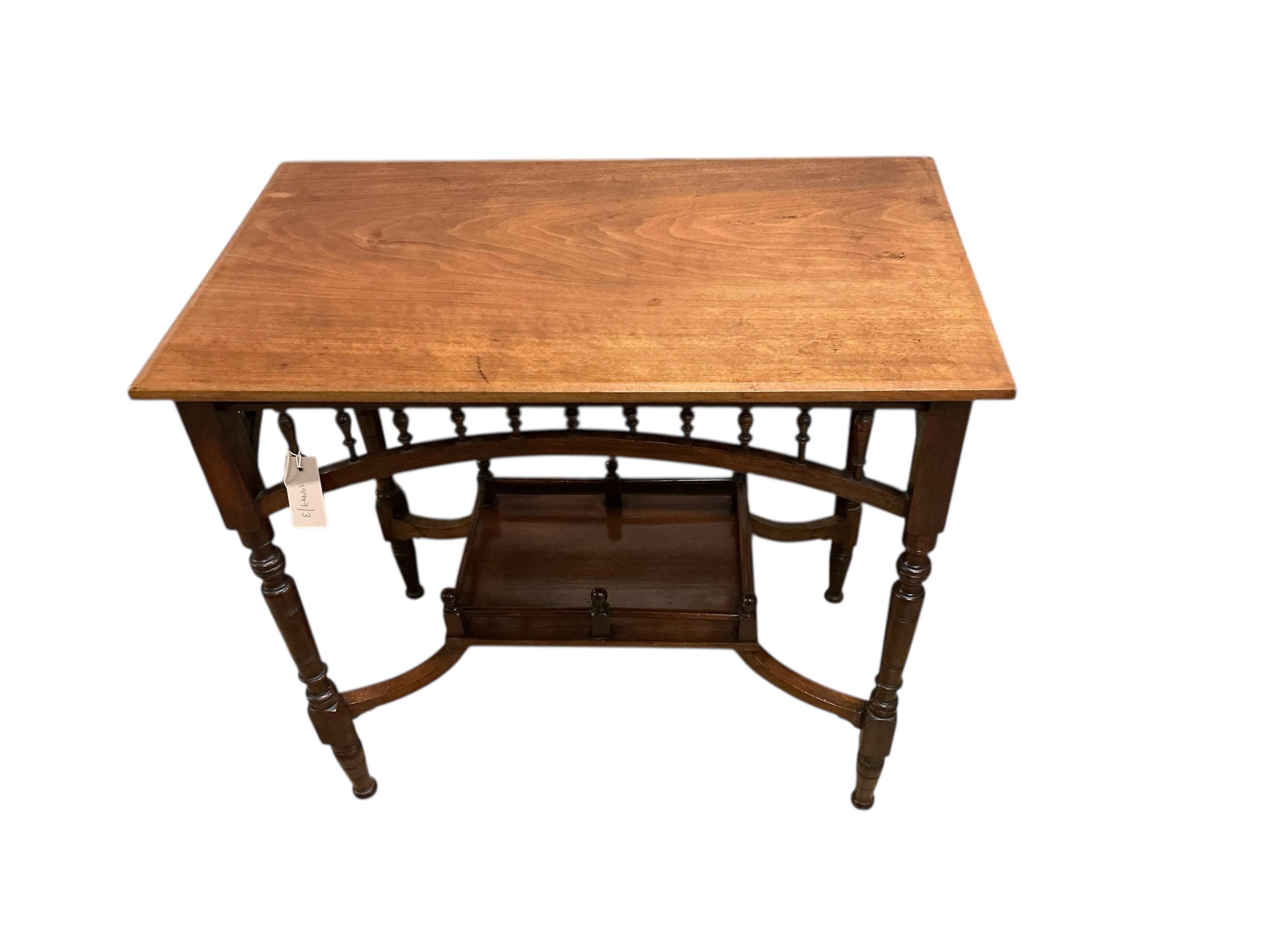A Victorian Aesthetic Movement rectangular walnut two tier occasional table, width 74cm, depth 44cm, height 69cm